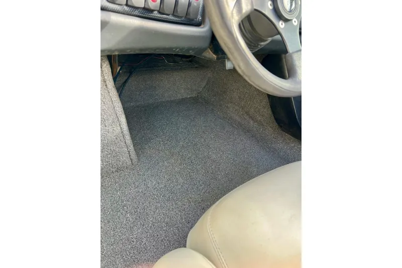 Slide: The Image of 2002 Malibu Sportster LX interior, showing steering wheel and carpeted floor. - 26