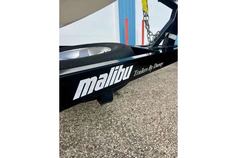 Slide: The Image of Close-up of a 2002 Malibu Sportster LX trailer with "Trailers By Dorsey" branding. - 3