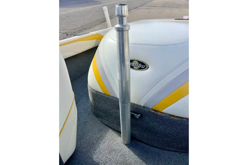 Slide: The Image of 2002 Malibu Sportster LX interior with yellow and white upholstery, featuring a metal pole. - 31