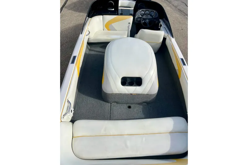 Slide: The Image of 2002 Malibu Sportster LX boat interior with white and yellow seating, steering wheel, and dashboard. - 33