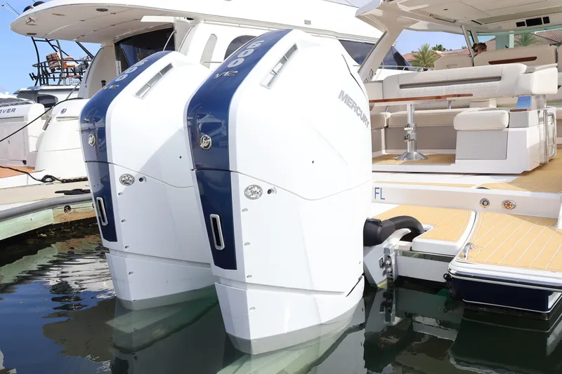 Slide: The Image of 2023 Tiara Yachts 43 LS with dual Mercury outboard engines docked at marina. - 11