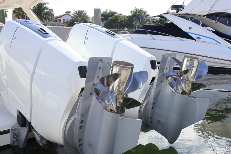 Slide: The Image of 2023 Tiara Yachts 43 LS with dual outboard engines docked at marina. - 12