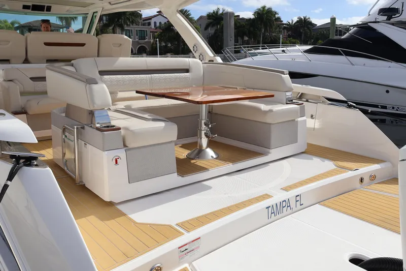 Slide: The Image of 2023 Tiara Yachts 43 LS luxury yacht interior with seating and table, docked in Tampa, FL. - 14