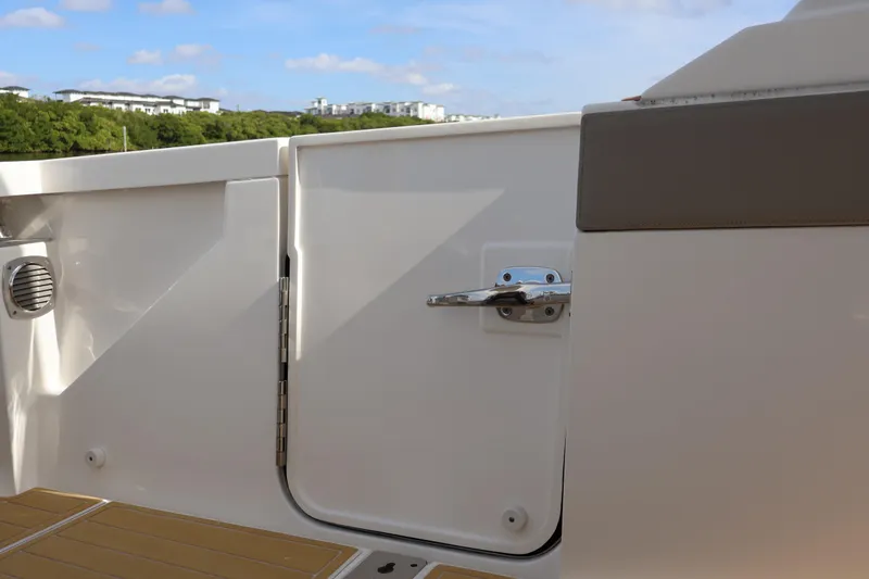 Slide: The Image of 2023 Tiara Yachts 43 LS boat deck with closed hatch and scenic background. - 21