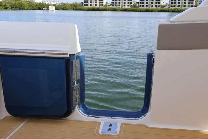 Slide: The Image of 2023 Tiara Yachts 43 LS swim platform door with scenic water view. - 23