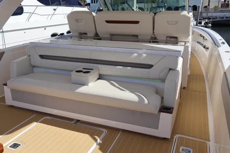 Slide: The Image of Luxurious seating area on 2023 Tiara Yachts 43 LS with elegant design and cup holders. - 25