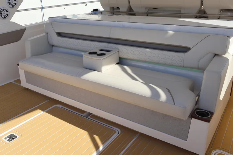 Slide: The Image of Luxurious seating area on 2023 Tiara Yachts 43 LS with integrated cup holders. - 27