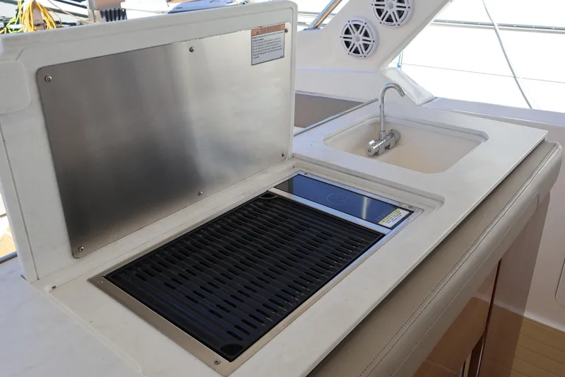 Slide: The Image of Outdoor kitchen on 2023 Tiara Yachts 43 LS with grill and sink. - 28