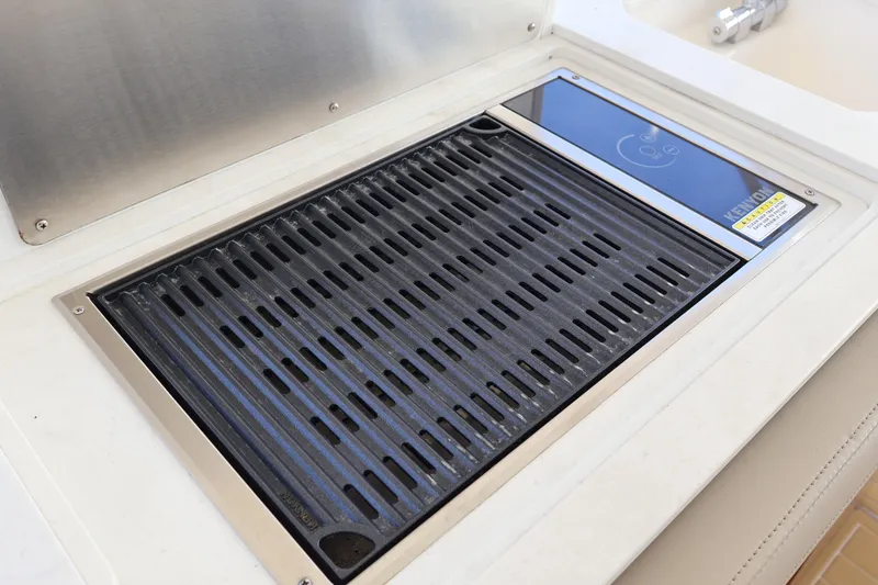 Slide: The Image of Built-in grill on 2023 Tiara Yachts 43 LS, featuring sleek stainless steel design. - 29