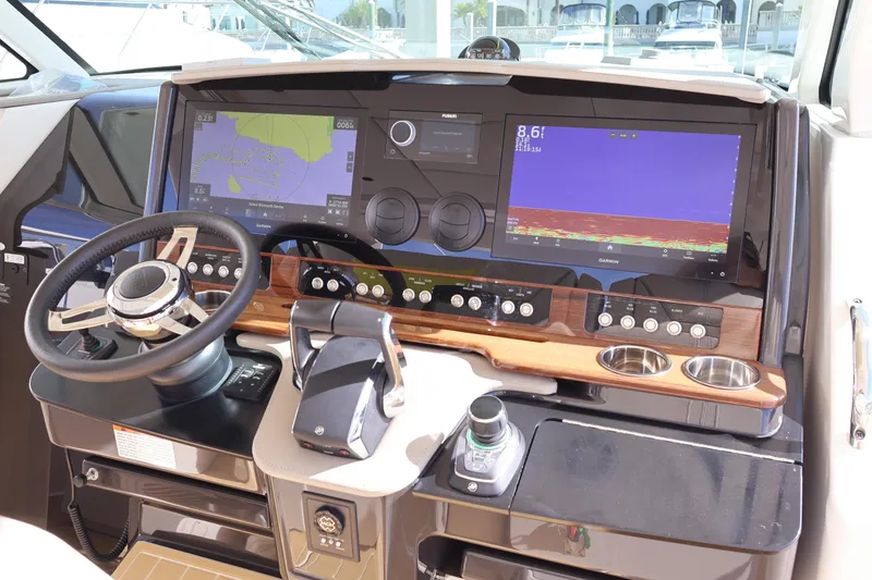 Slide: The Image of 2023 Tiara Yachts 43 LS helm with advanced navigation displays and controls. - 41