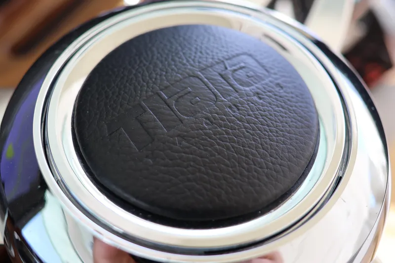 Slide: The Image of Close-up of 2023 Tiara Yachts 43 LS steering wheel with embossed logo. - 43