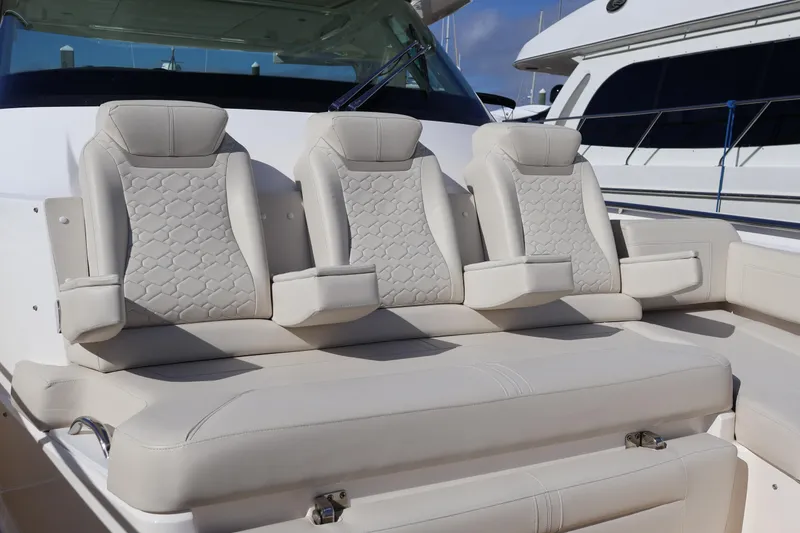 Slide: The Image of Luxurious seating on 2023 Tiara Yachts 43 LS, featuring elegant, cushioned design. - 50