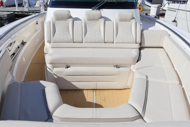Slide: The Image of Luxurious seating area on 2023 Tiara Yachts 43 LS with elegant white upholstery. - 56