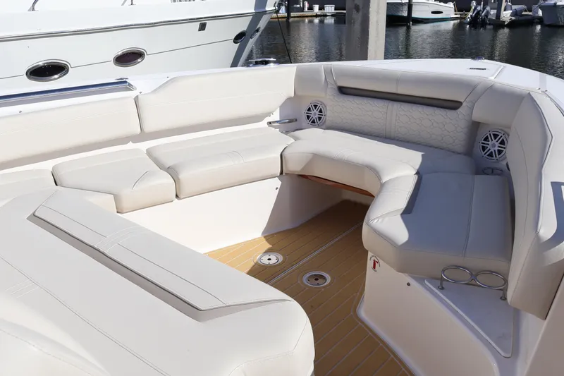 Slide: The Image of Luxurious seating area on 2023 Tiara Yachts 43 LS, featuring elegant white upholstery. - 57
