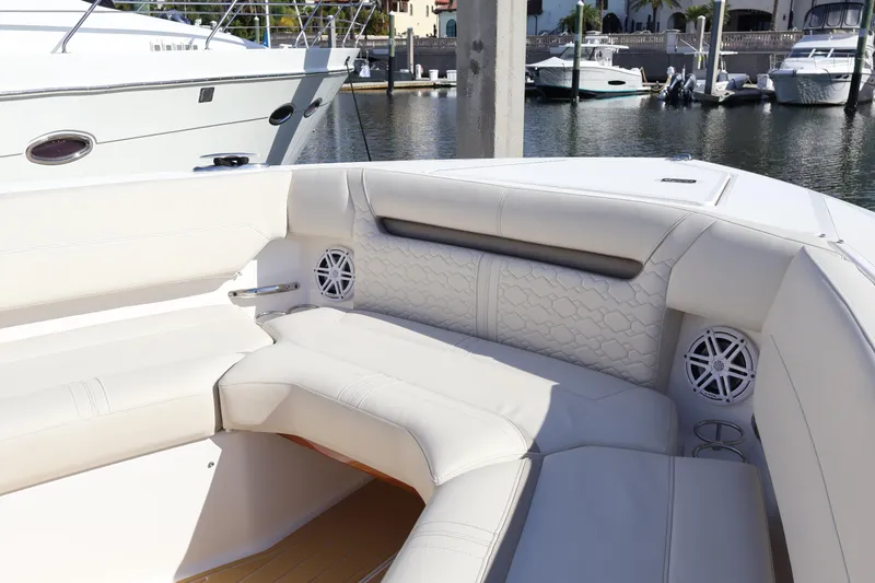 Slide: The Image of Luxurious seating area on 2023 Tiara Yachts 43 LS, docked at a marina. - 58