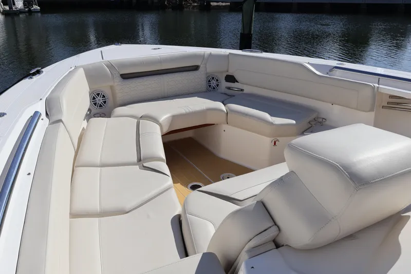 Slide: The Image of Luxurious seating area on 2023 Tiara Yachts 43 LS, featuring elegant white upholstery. - 59