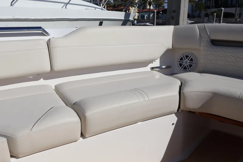 Slide: The Image of Luxurious seating on 2023 Tiara Yachts 43 LS, featuring elegant white upholstery. - 60