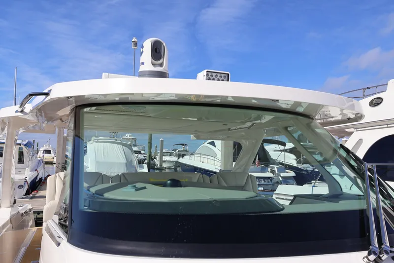 Slide: The Image of 2023 Tiara Yachts 43 LS at marina, showcasing sleek design and advanced features. - 63