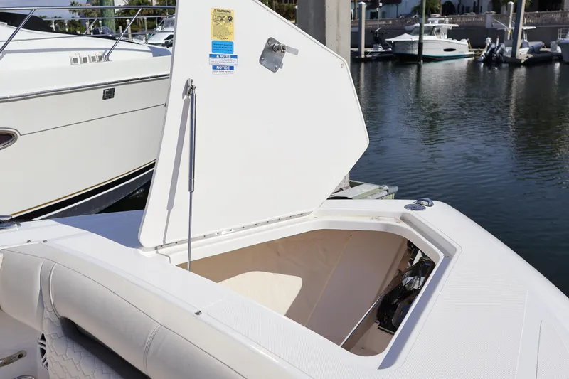 Slide: The Image of 2023 Tiara Yachts 43 LS boat with open storage compartment at marina. - 66