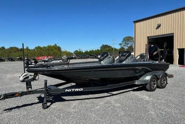 Slide: The Image of 2024 Nitro Z21 boat on trailer in outdoor setting near a warehouse. - 7
