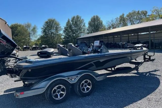 Slide: The Image of 2024 Nitro Z21 boat on trailer in outdoor storage area. - 9