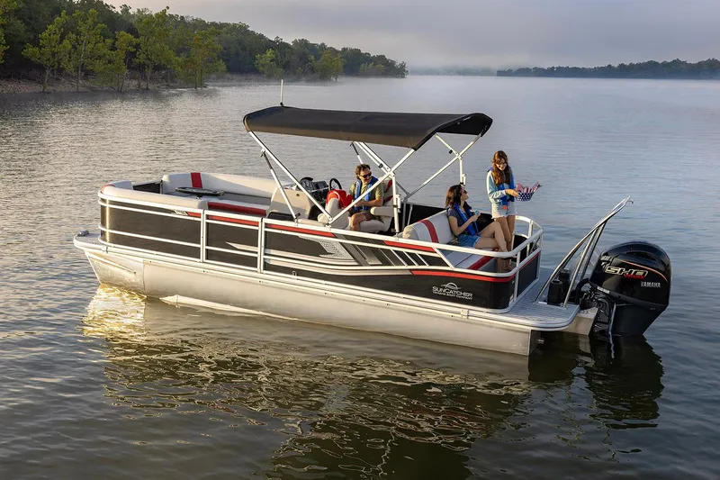 Slide: The Image of 2026 SunCatcher Select 322SL pontoon boat under clear blue sky. - 1