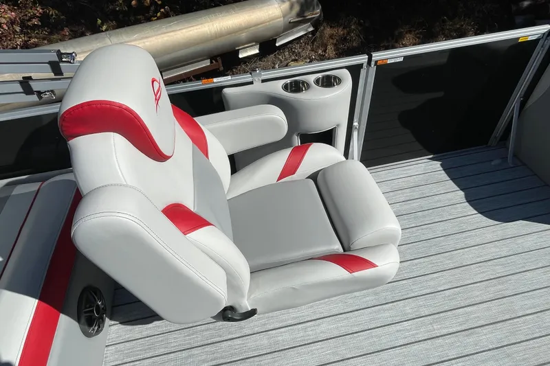 Slide: The Image of 2026 SunCatcher Select 322SL boat deck with storage compartment and cup holders. - 14