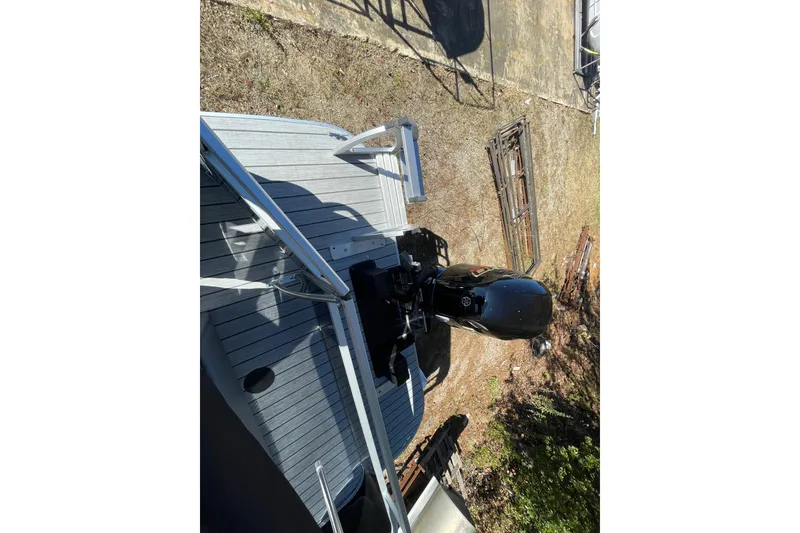 Slide: The Image of 2026 SunCatcher Select 322SL boat with 175 horsepower engine, ultra-low emission. - 20