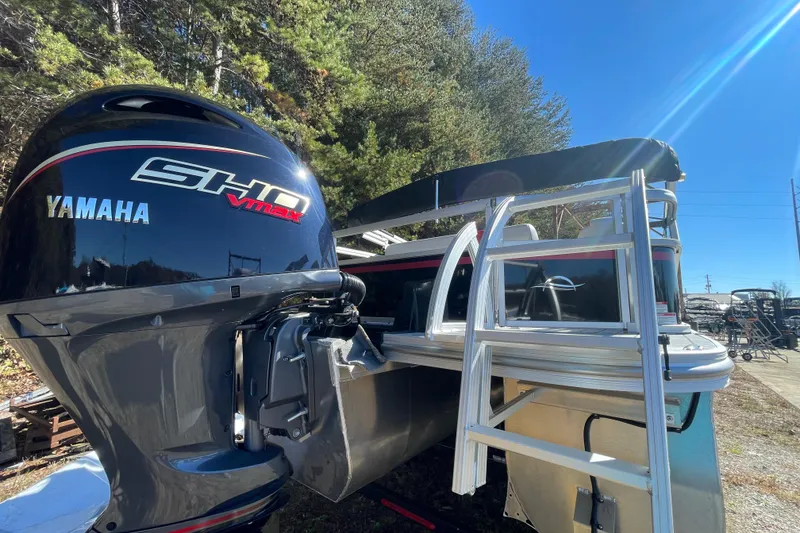 Slide: The Image of Manufacturer Provided Image: Interior of 2026 SunCatcher Select 322SL boat with modern steering console and seating. - 23