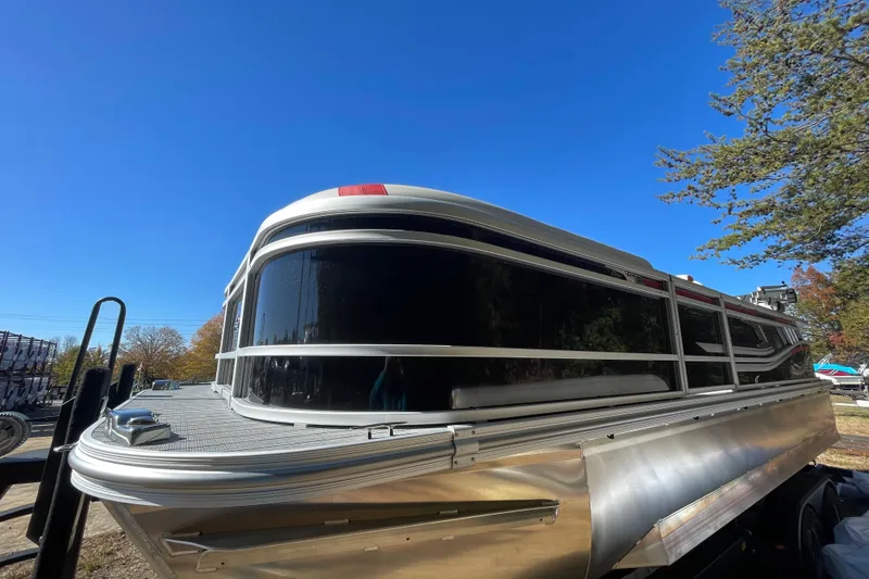 Slide: The Image of Manufacturer Provided Image: 2026 SunCatcher Select 322SL pontoon boat cruising on a scenic lake. - 25