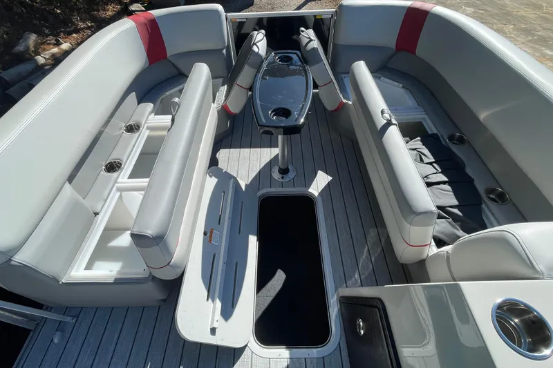 Slide: The Image of 2026 SunCatcher Select 322SL boat dashboard with steering wheel and navigation controls. - 7