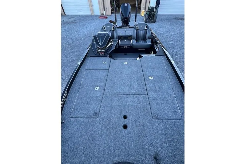 The Image of 2024 Ranger Z521R boat interior with spacious deck and seating. - 1