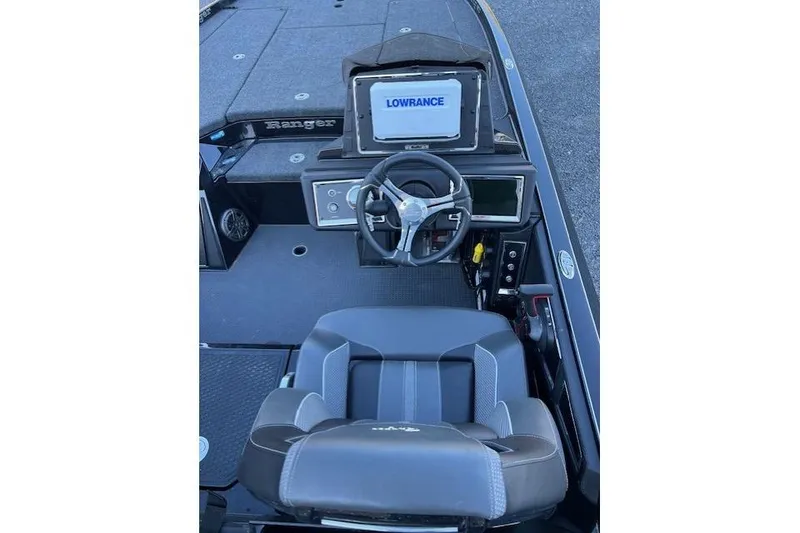Slide: The Image of 2024 Ranger Z521R boat cockpit with Lowrance display and steering wheel. - 4