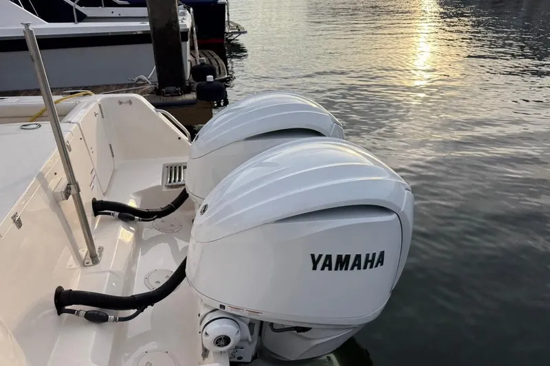 Slide: The Image of 2022 Grady-White Freedom 307 boat with twin Yamaha outboard engines at dock. - 13