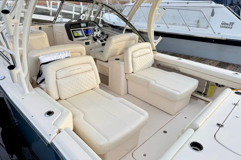 Slide: The Image of 2022 Grady-White Freedom 307 boat interior with luxurious seating and modern dashboard. - 17