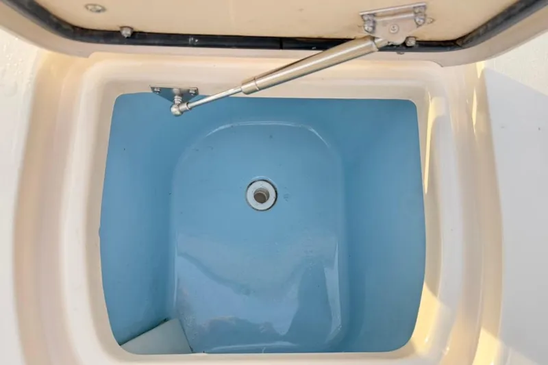 Slide: The Image of Open storage compartment on 2022 Grady-White Freedom 307 boat. - 19