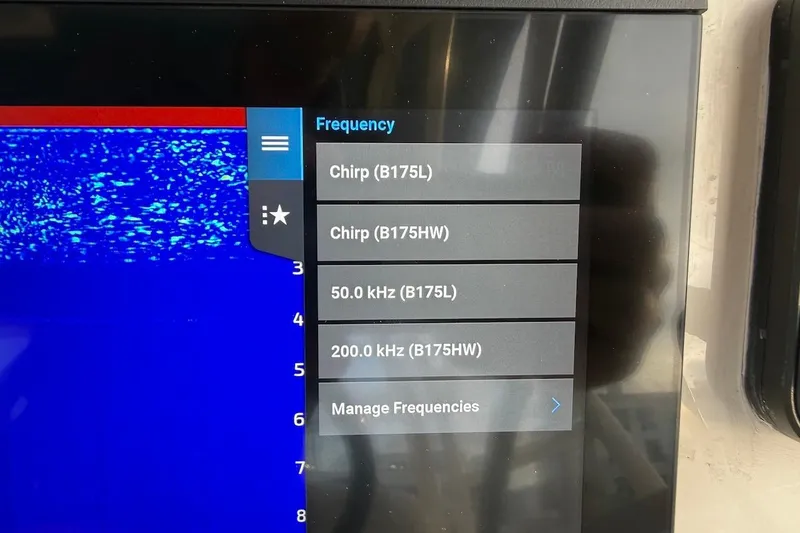 Slide: The Image of Sonar display on 2022 Grady-White Freedom 307, showing frequency options and settings. - 31