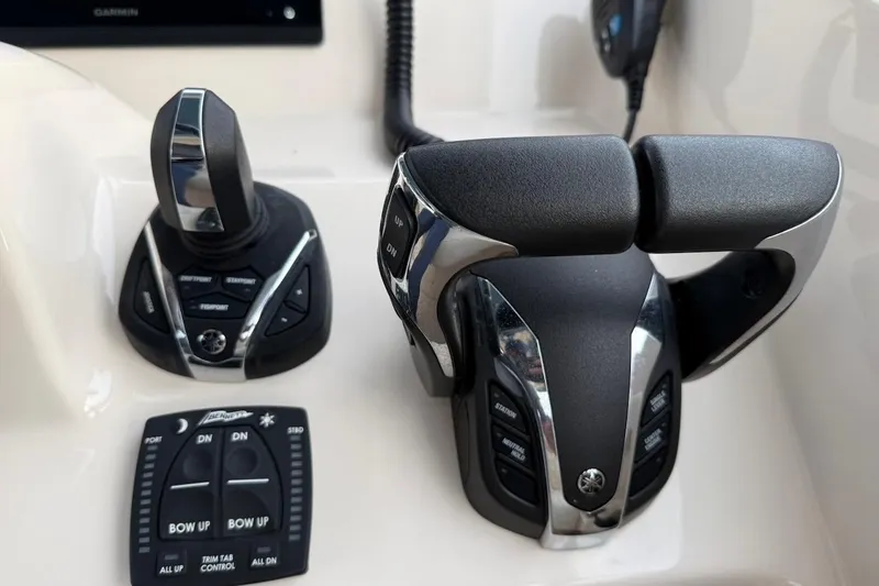 Slide: The Image of Control panel of 2022 Grady-White Freedom 307 boat with joystick and throttle. - 35