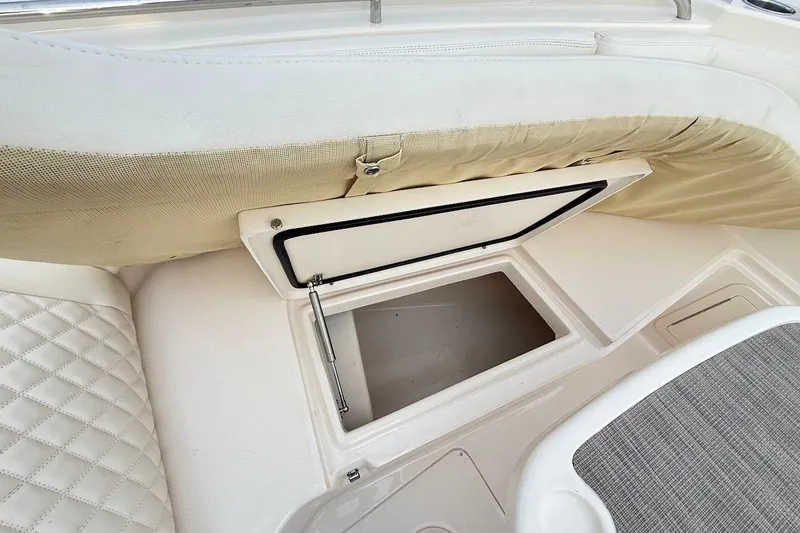 Slide: The Image of 2022 Grady-White Freedom 307 boat storage compartment with cushioned seating. - 45