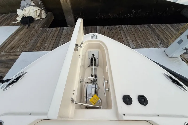 Slide: The Image of 2022 Grady-White Freedom 307 boat anchor compartment at dock. - 46
