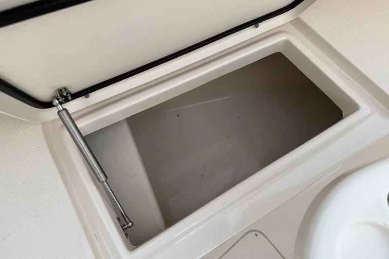Slide: The Image of Open storage compartment on 2022 Grady-White Freedom 307 boat. - 47