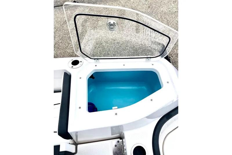 Slide: The Image of Open storage compartment on 2022 Yamaha Boats 255 FSH Sport H. - 18