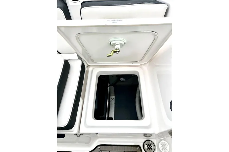 Slide: The Image of 2022 Yamaha Boats 255 FSH Sport H storage compartment with open hatch. - 24