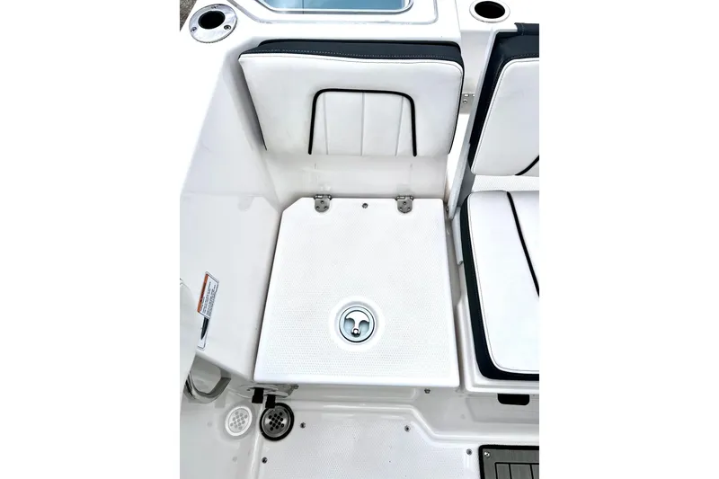 Slide: The Image of 2022 Yamaha Boats 255 FSH Sport H interior seating and storage area. - 26