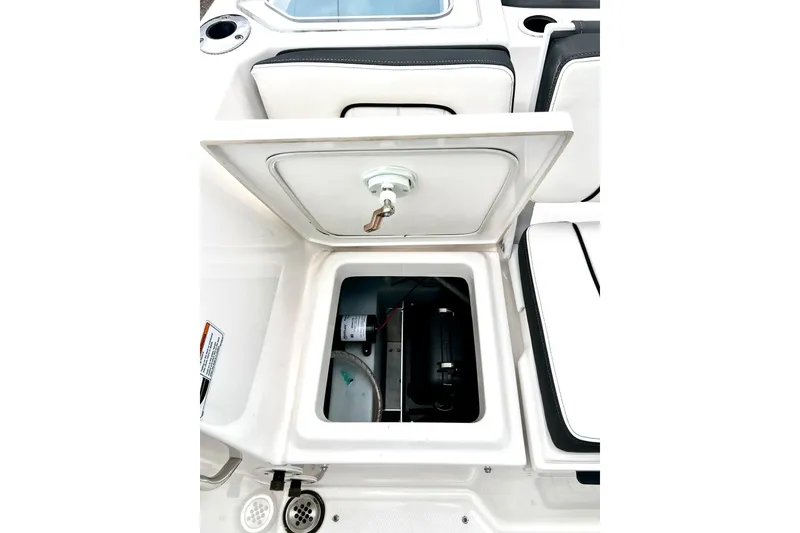 Slide: The Image of Open storage compartment on 2022 Yamaha Boats 255 FSH Sport H, showcasing interior features. - 27