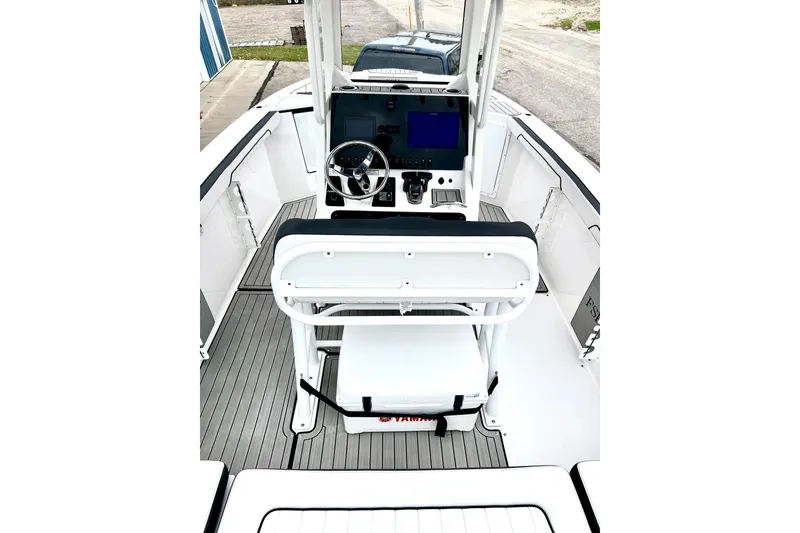 Slide: The Image of 2022 Yamaha Boats 255 FSH Sport H interior with helm and seating. - 33