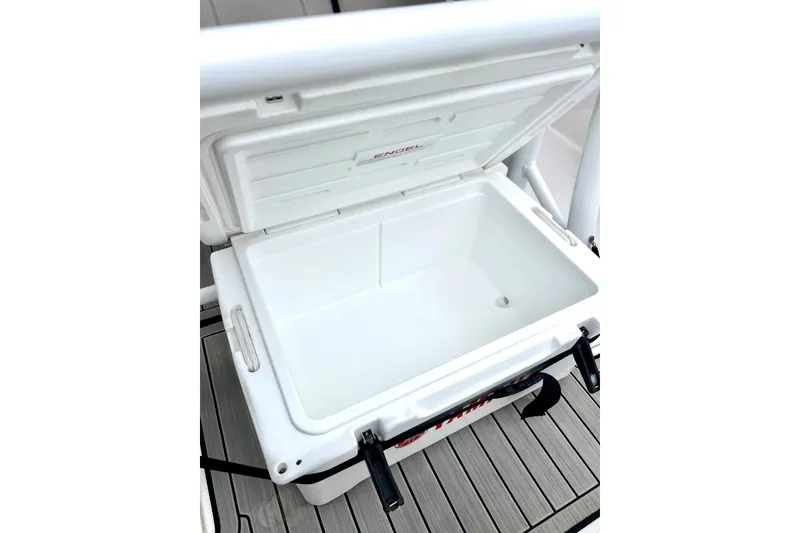 Slide: The Image of Open cooler on 2022 Yamaha Boats 255 FSH Sport H, showcasing spacious interior. - 35
