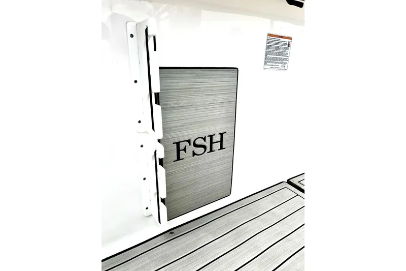 Slide: The Image of 2022 Yamaha Boats 255 FSH Sport H, featuring sleek deck design and FSH logo. - 36