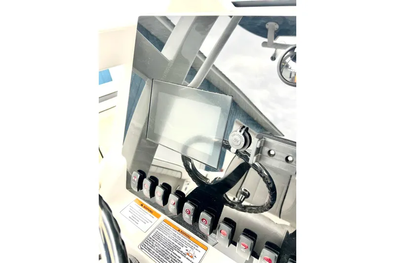 Slide: The Image of 2022 Yamaha Boats 255 FSH Sport H dashboard with controls and display screen. - 40