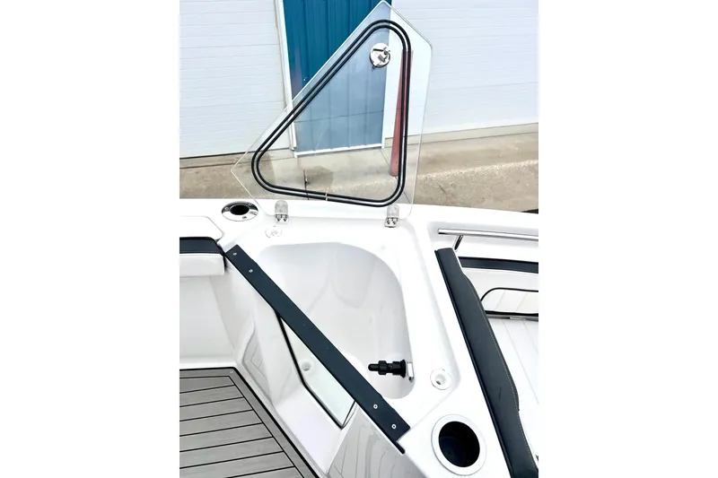Slide: The Image of 2022 Yamaha Boats 255 FSH Sport H, open storage compartment, sleek design, modern features. - 49